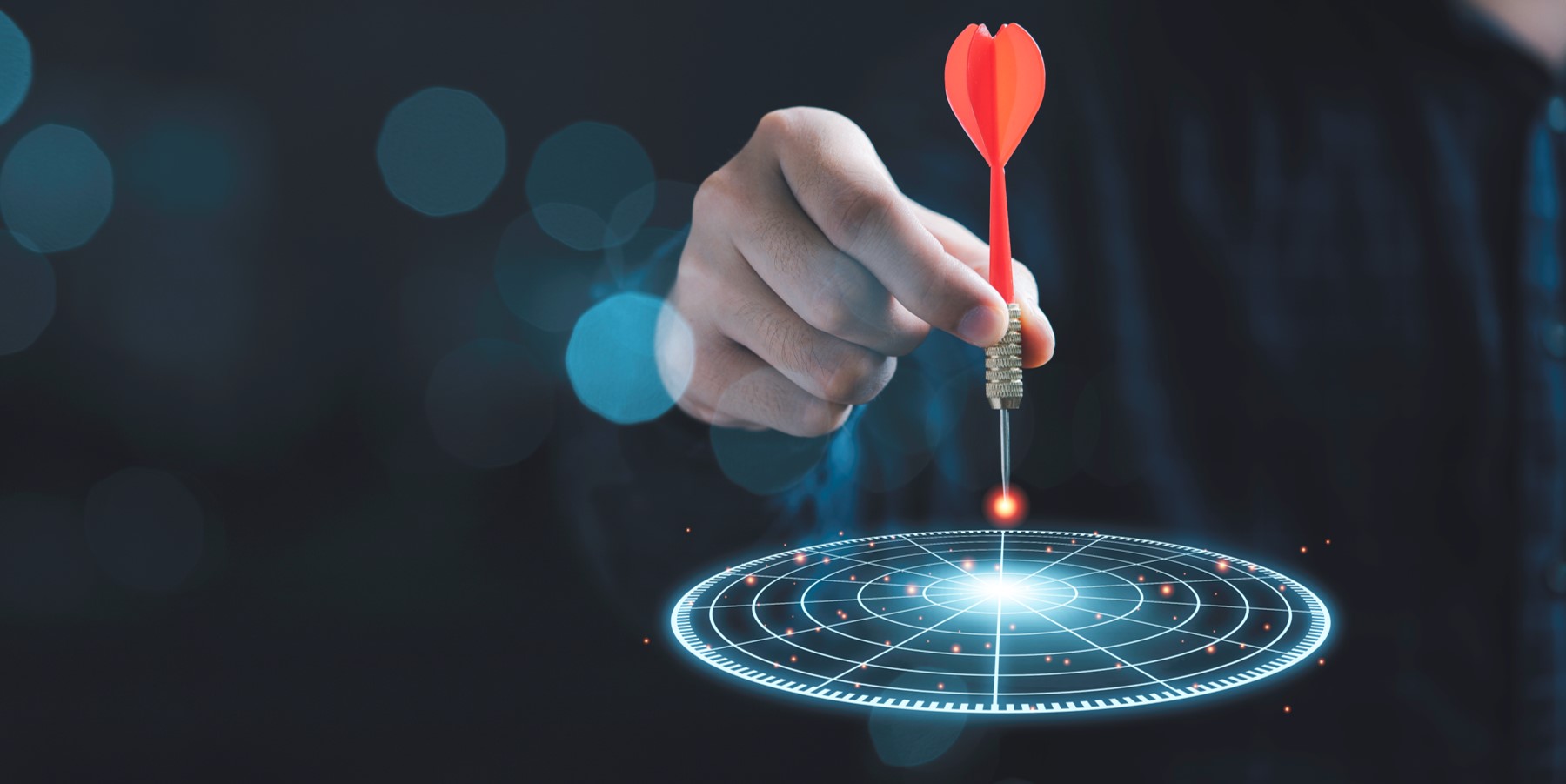 businessman throwing a red arrow dart to virtual target